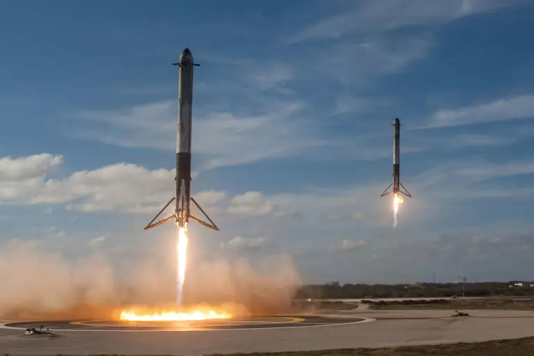 Two SpaceX Falcon 9 rockets execute a synchronized landing, touching down with precision on designated landing pads. This SpaceX launch highlights the company’s advancements in reusable rocket technology, revolutionizing space travel.